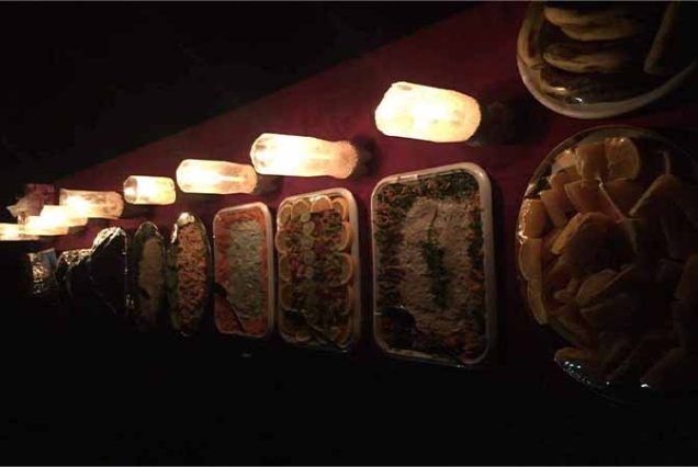"Authentic Bedouin dinner under candlelight in the desert of Marsa Alam, Egyptian cuisine and cultural night"